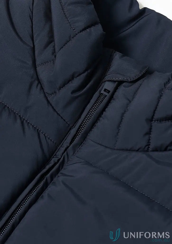 Dark blue sustainable insulated puffer vest made from recycled PET bottles with zipper closure