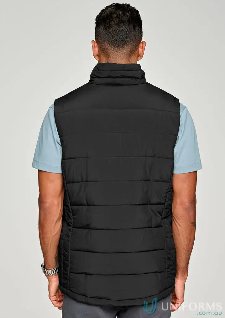 Men’s black sustainable insulated puffer vest made from recycled PET bottles with light blue shirt