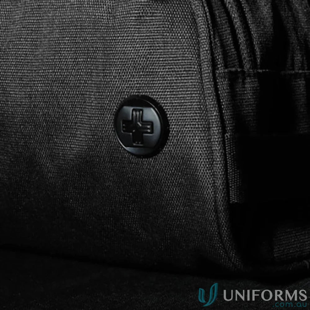 Black fabric with Swiss cross button on Swissdigital Arosa Wash Bag, great for work uniforms