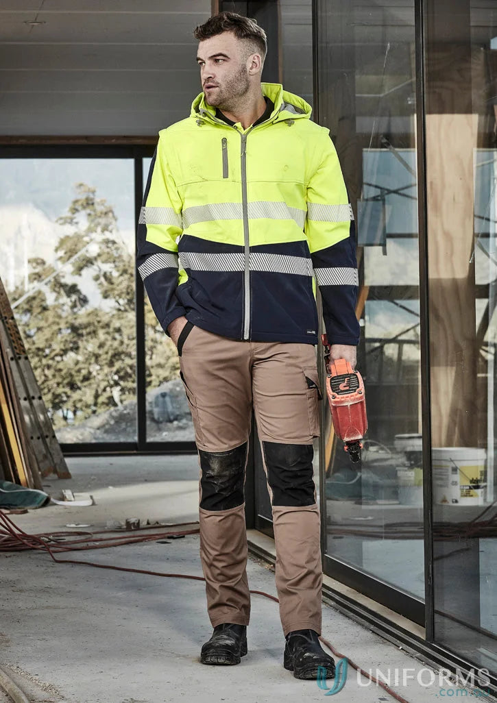 Man wearing syzmik streetworx softshell jacket, 2-in-1 stretch softshell workwear
