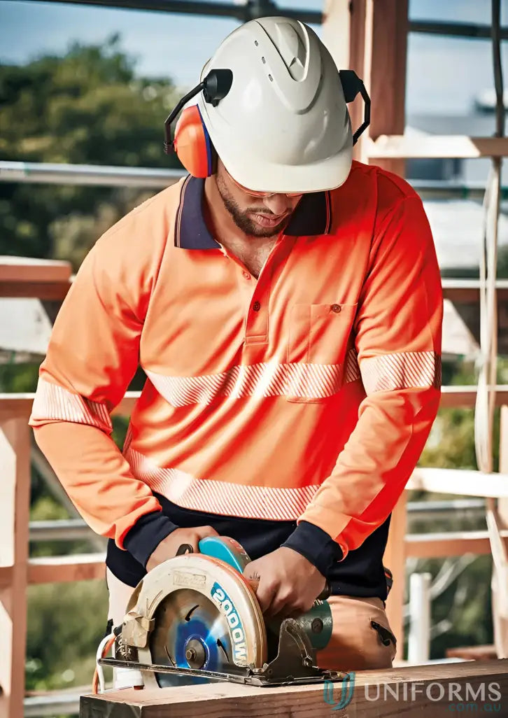 Construction worker with circular saw wearing Syzmic HiVis Segmented Hooped Taped LS Polo