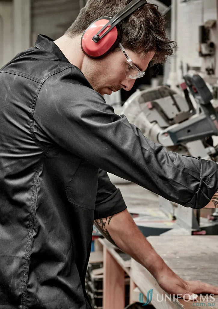 Man in Syzmik men’s lightweight tradie long sleeve cotton twill shirt using a chop saw