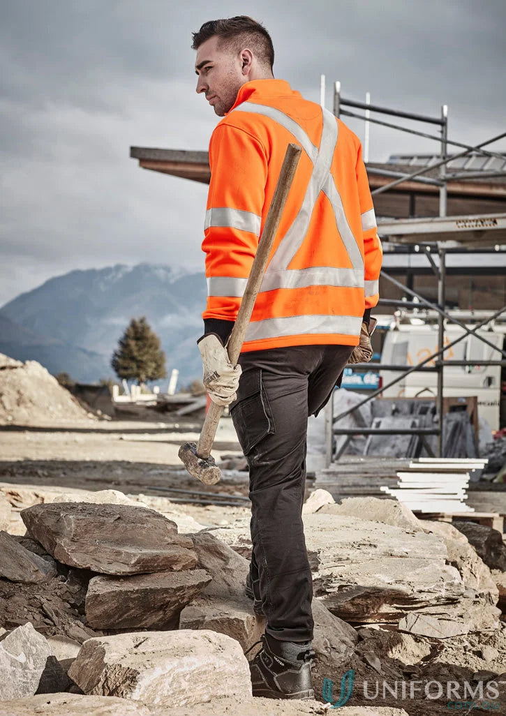 Construction worker wearing Syzmik Unisex RAIL Jumper ZT660 with ribbed elastic cuffs