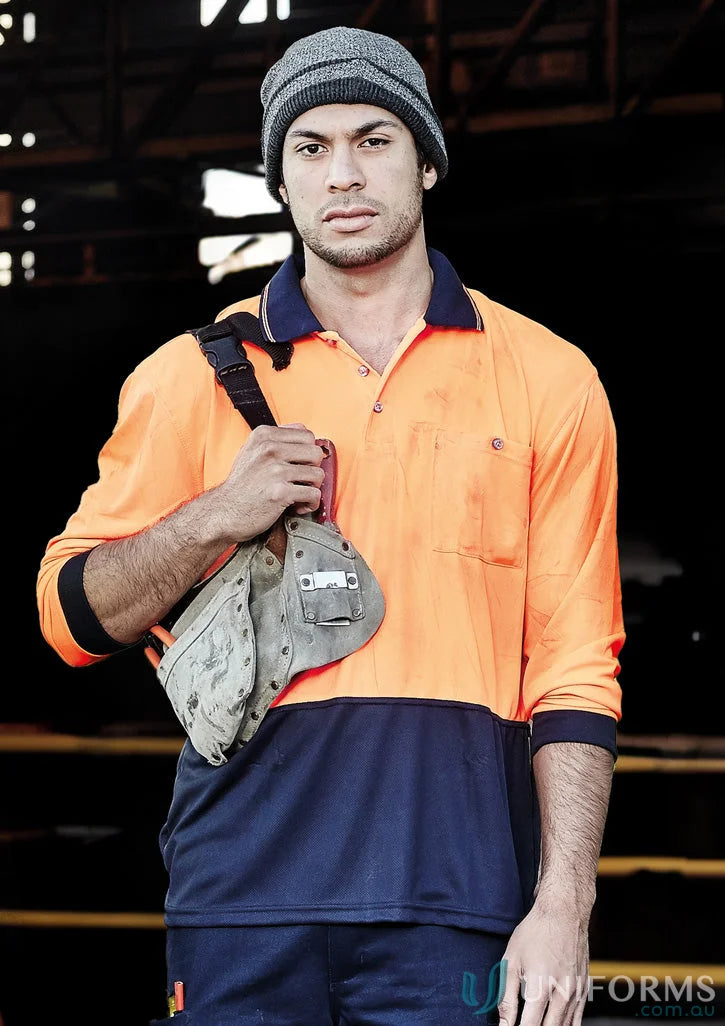 Man in workwear with tool bag wearing Syzmik Unisex Vis Basic Long Sleeve Polo