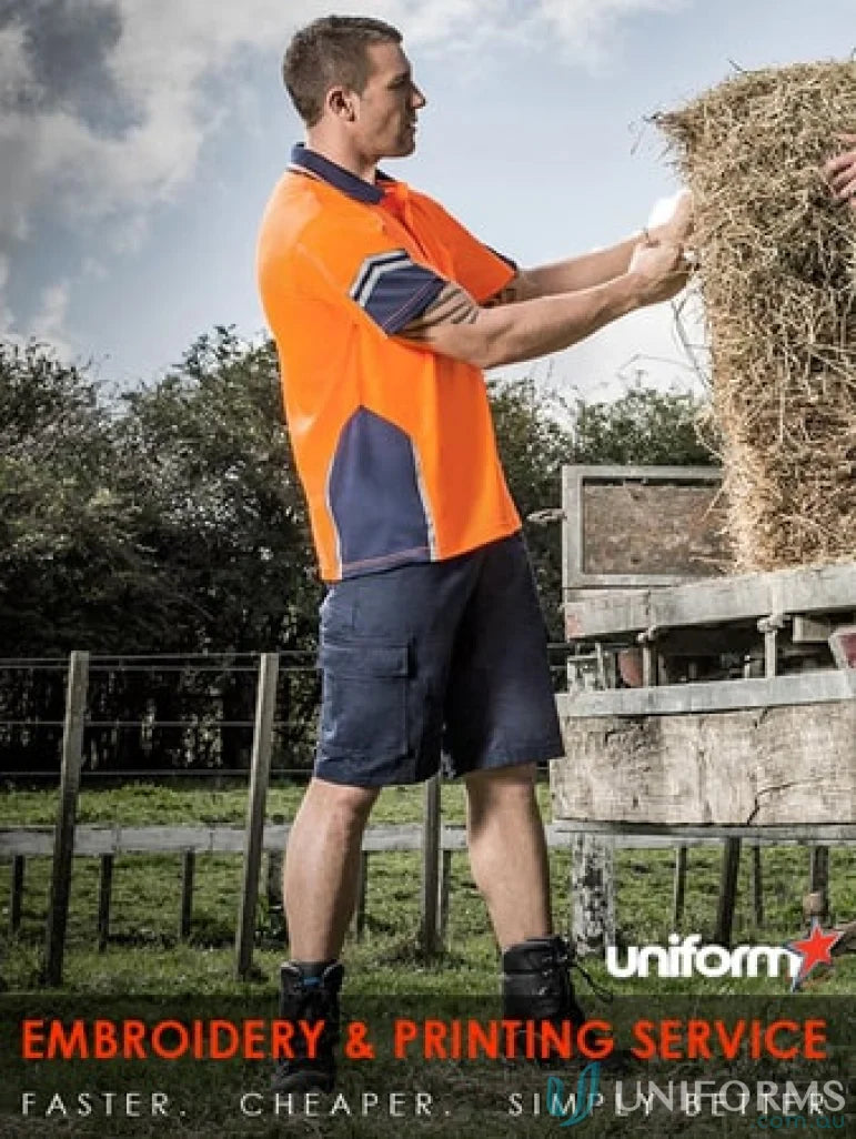 Man lifting hay bale in Syzmic Squad Safety SS Polo, sleeve polo zh237 ensures durability