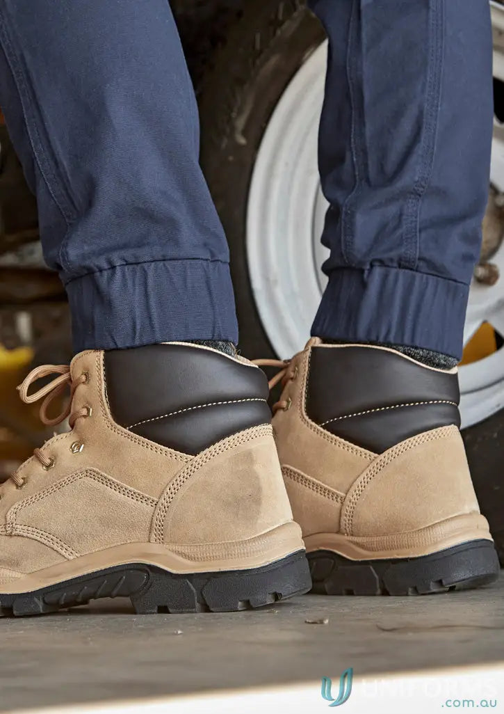 Tan work boots with Syzmic Streetworx Heritage Pant showing triple-stitched crotch panel