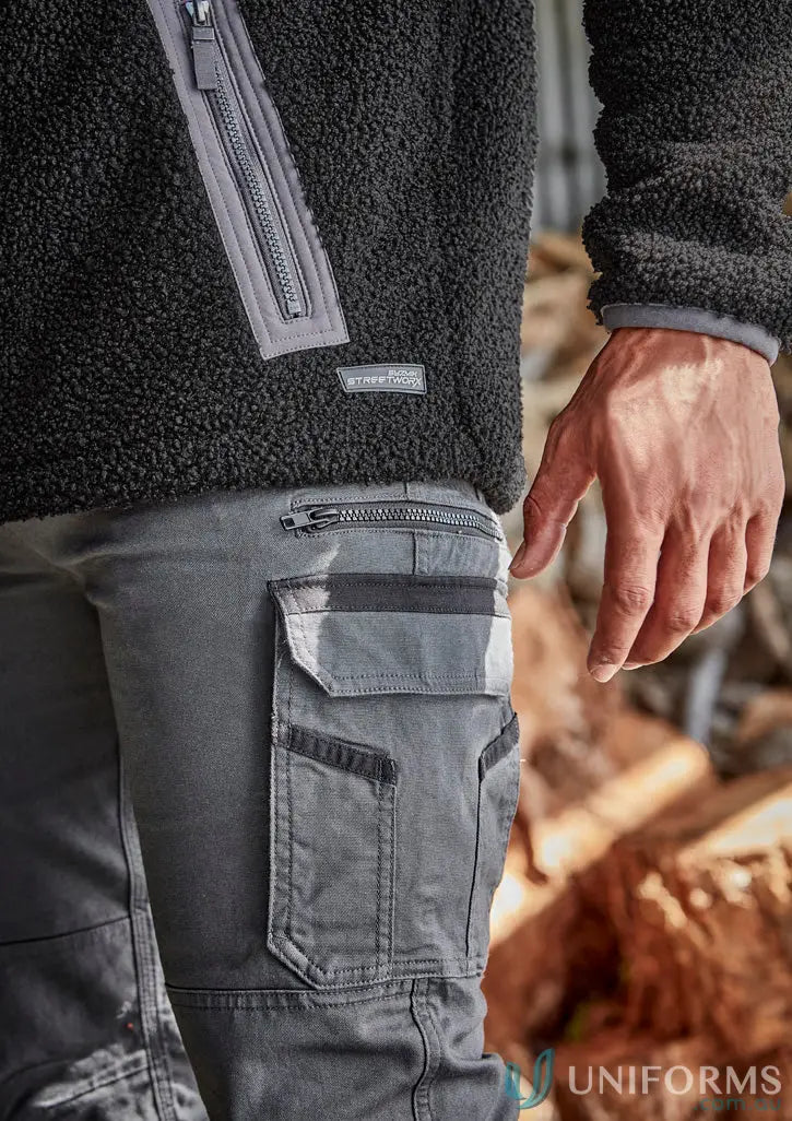 Man in black fleece jacket and grey cargo pants wearing Syzmic Streetworx Heritage Pant ZP820