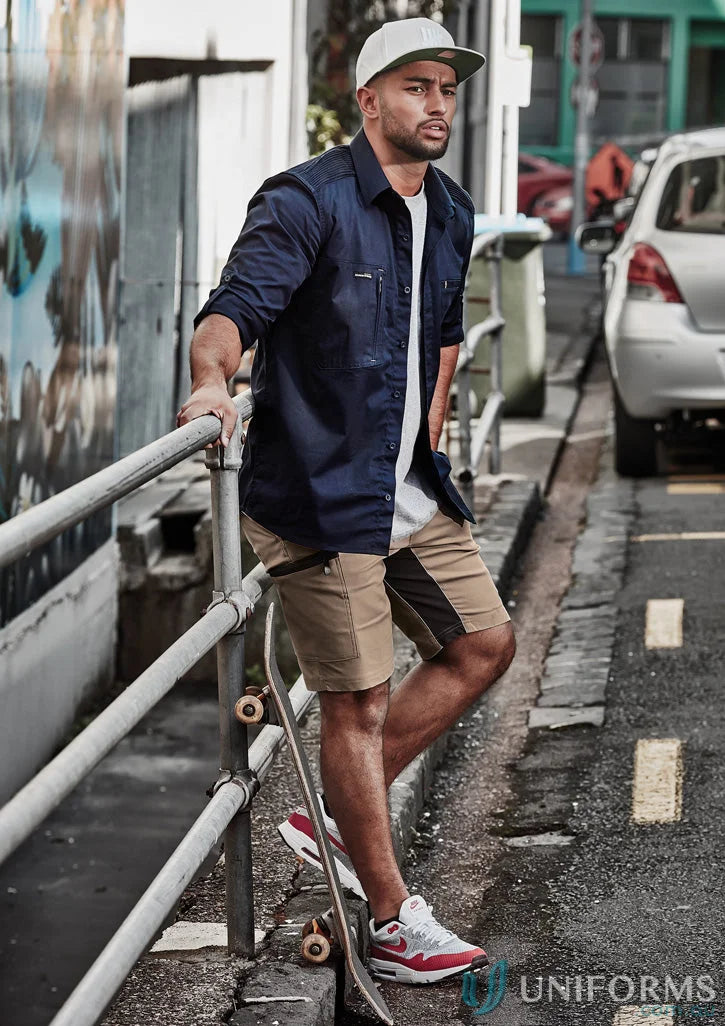 Man with skateboard wearing Syzmic Streetworx Stretch Shorts with four-way stretch crotch