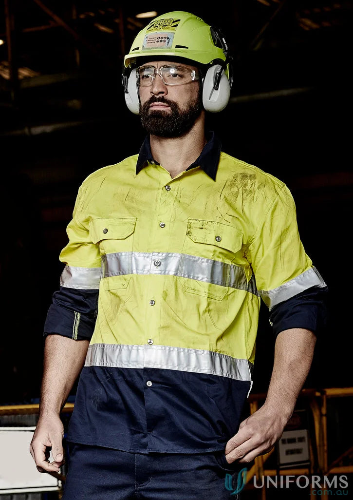 Man in safety gear wearing Syzmik Men’s Industrial Long Sleeve Shirt Hoop Taped zw123 for demanding work environments