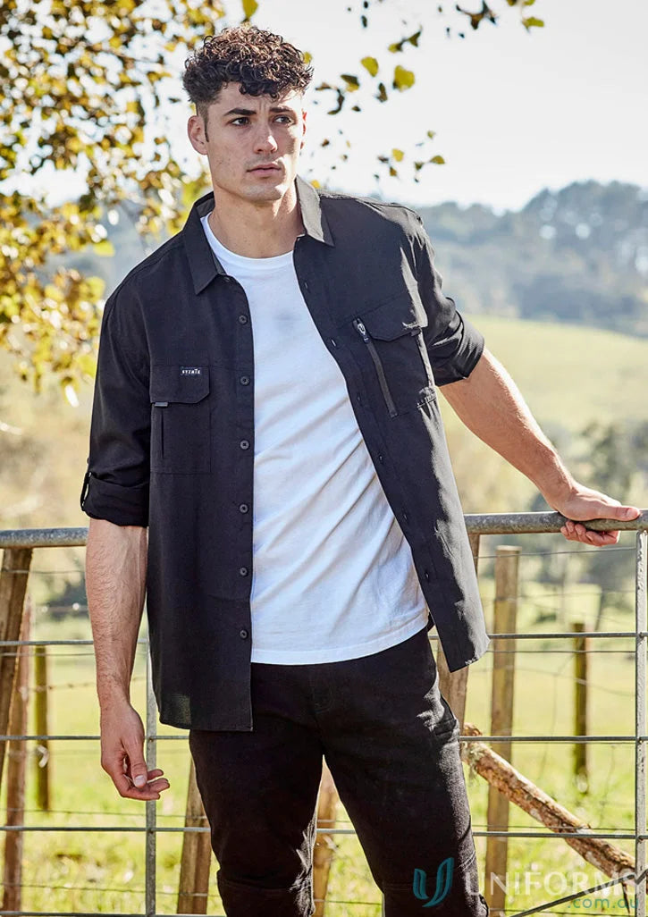 Man in black shirt and jeans wearing Syzmik Outdoor LS Shirt for men’s outdoor long style