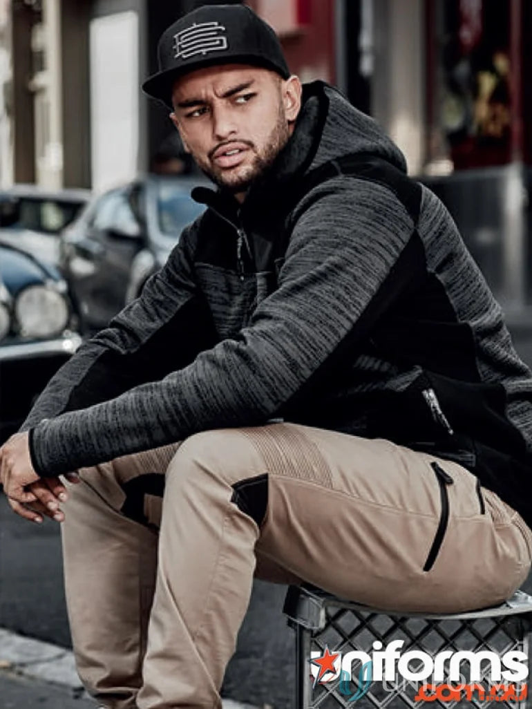 Man in gray and black hooded jacket and khaki pants wearing Syzmik Streetworx hoodie zt360