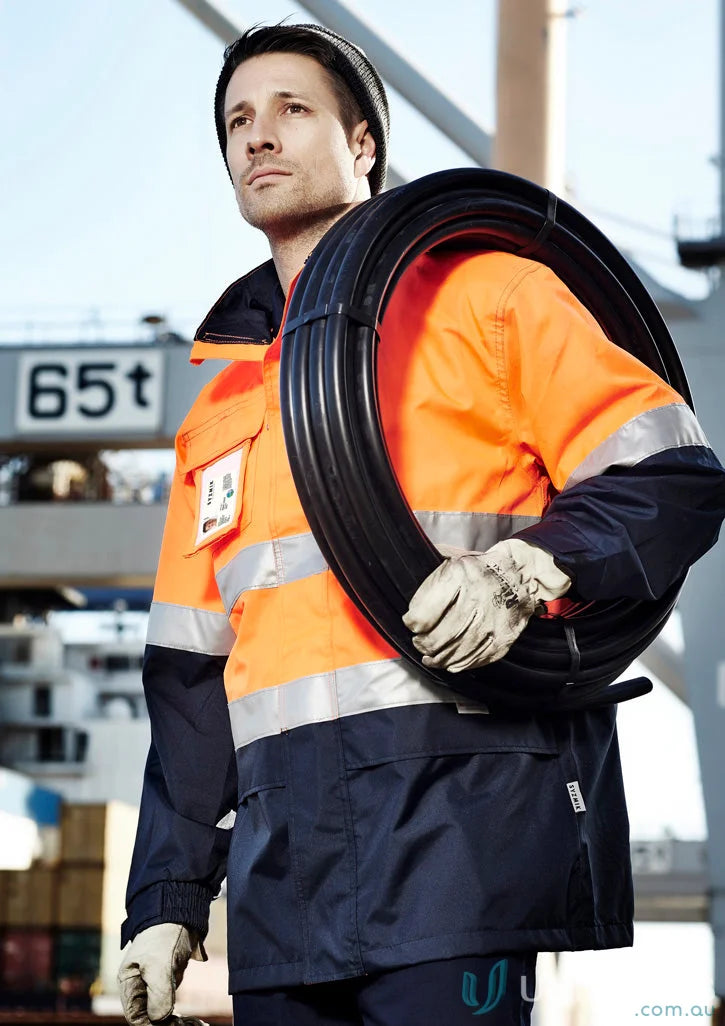 Man in Syzmik Ultralight Waterproof Jacket wearing high visibility work jacket