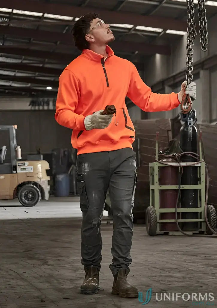Man in workwear holding chain wearing Syzmik Unisex Streetworx Water Resistant Pullover