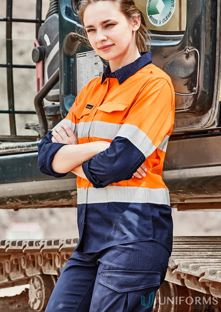 Woman in Syzmik women’s rugged high-vis shirt zw720 with reflective tape for safety