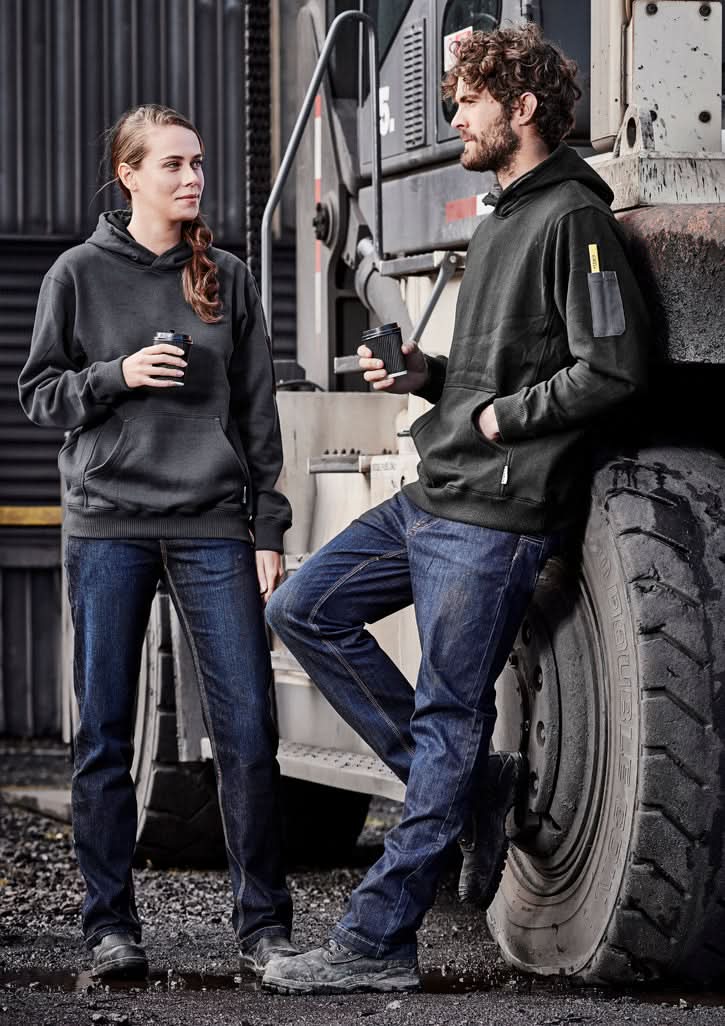 Two people in dark hoodies and jeans wearing Syzmik Womens Stretch Denim Work Jeans