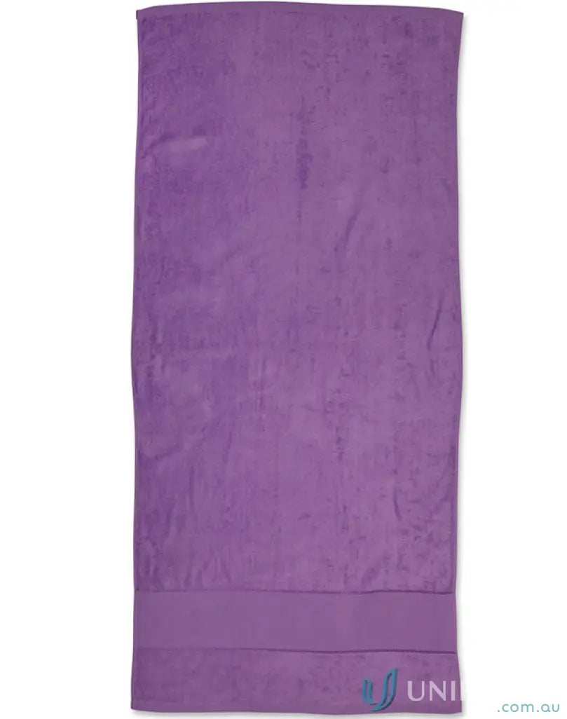 Purple plush towel from Terry Velour Beach Towel collection perfect for relaxing beach days