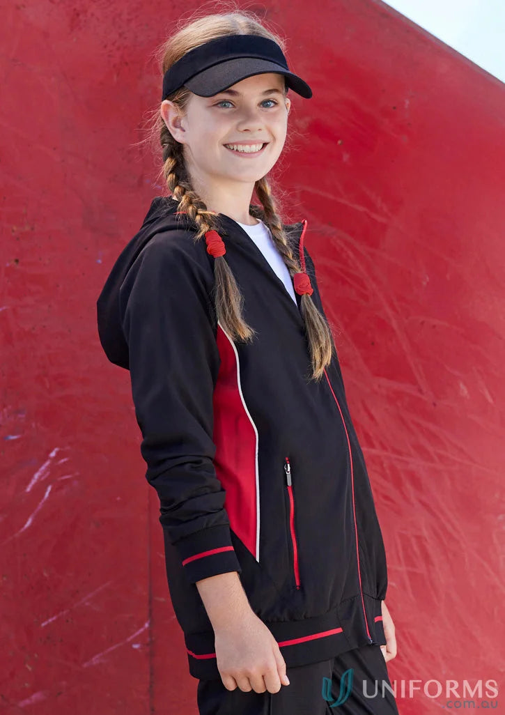 Girl in kids titan jacket j920k from Biz Collection Kids wearing a black and red hooded track jacket