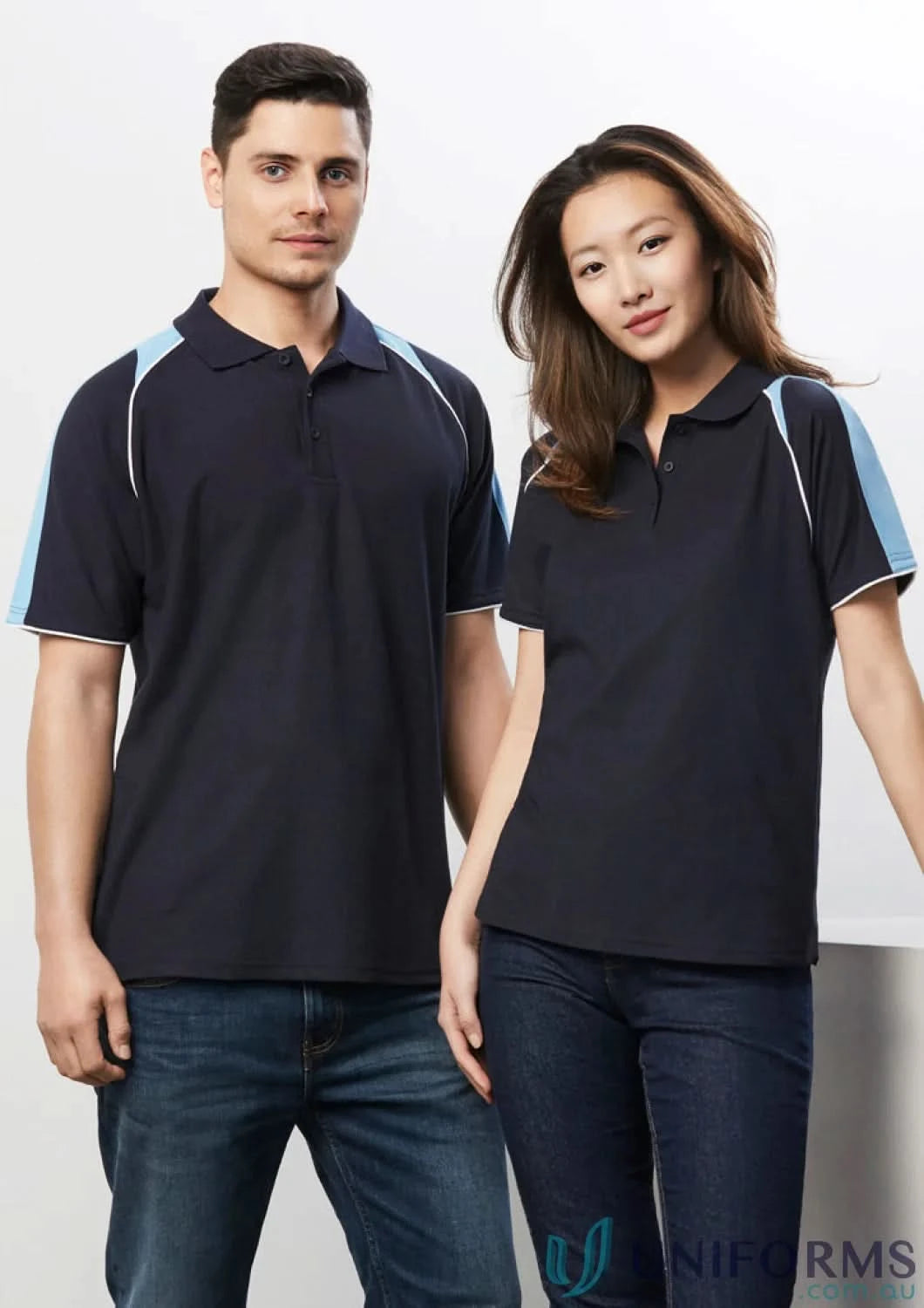 Two dark blue Triton Polo short sleeve shirts with contrast shoulder panels on man and woman