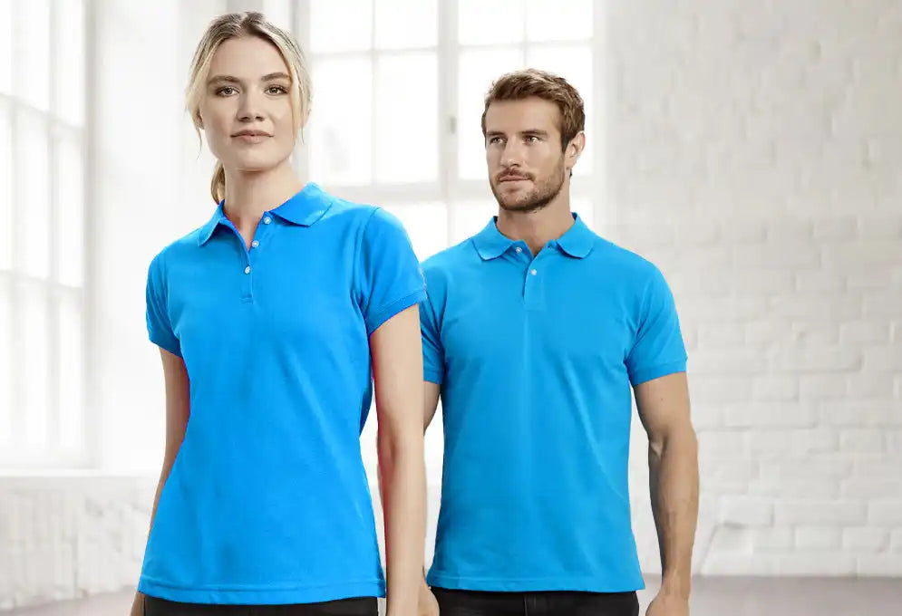 Two people wearing blue polo shirts.