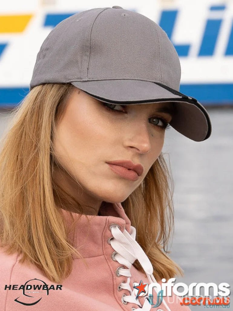 Grey baseball cap with black trim, featuring two striped peak design for cool style