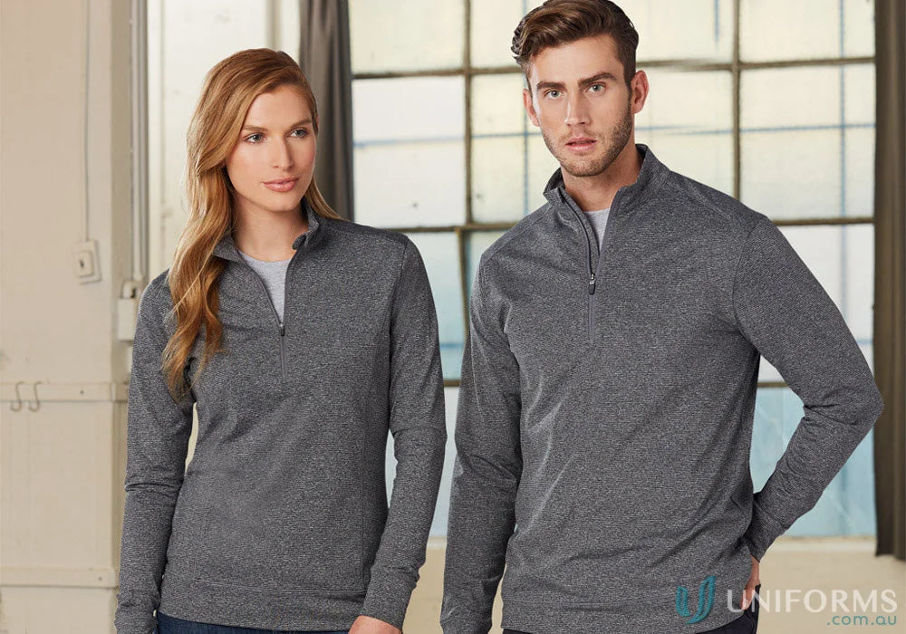 Two people wearing gray Ultimate Men’s Half Zip Sweat Tops showing winning spirit ultimate style