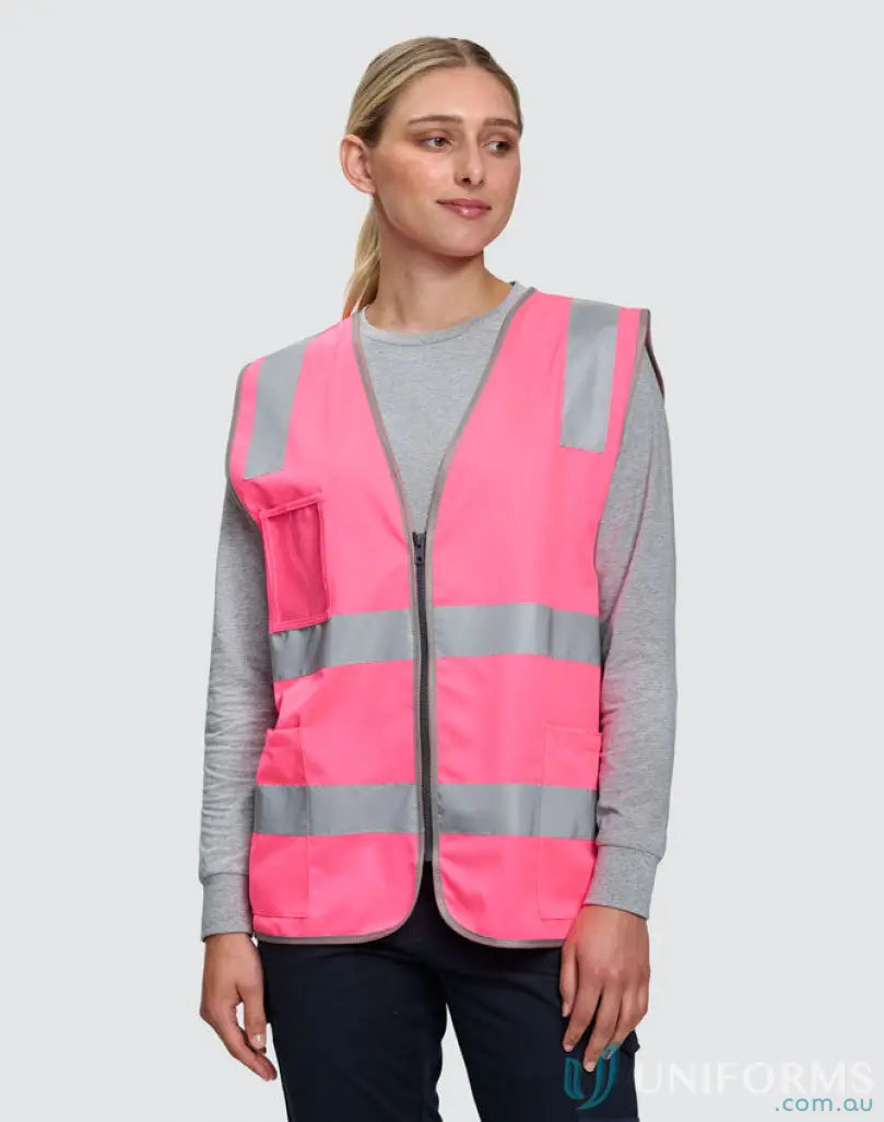 Woman modeling sw04 hi-vis safety vest with utility pockets and reflective strips
