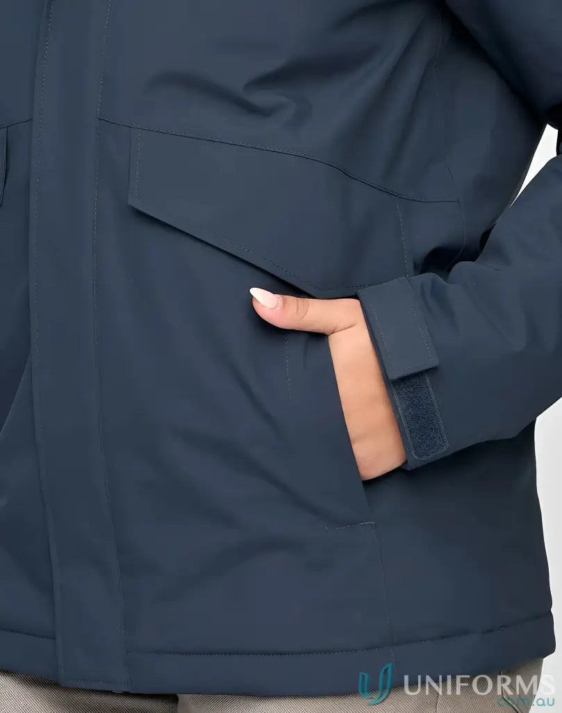 Person’s hand in side pocket of Vic Metro Waterproof Quilted Jacket for rain protection