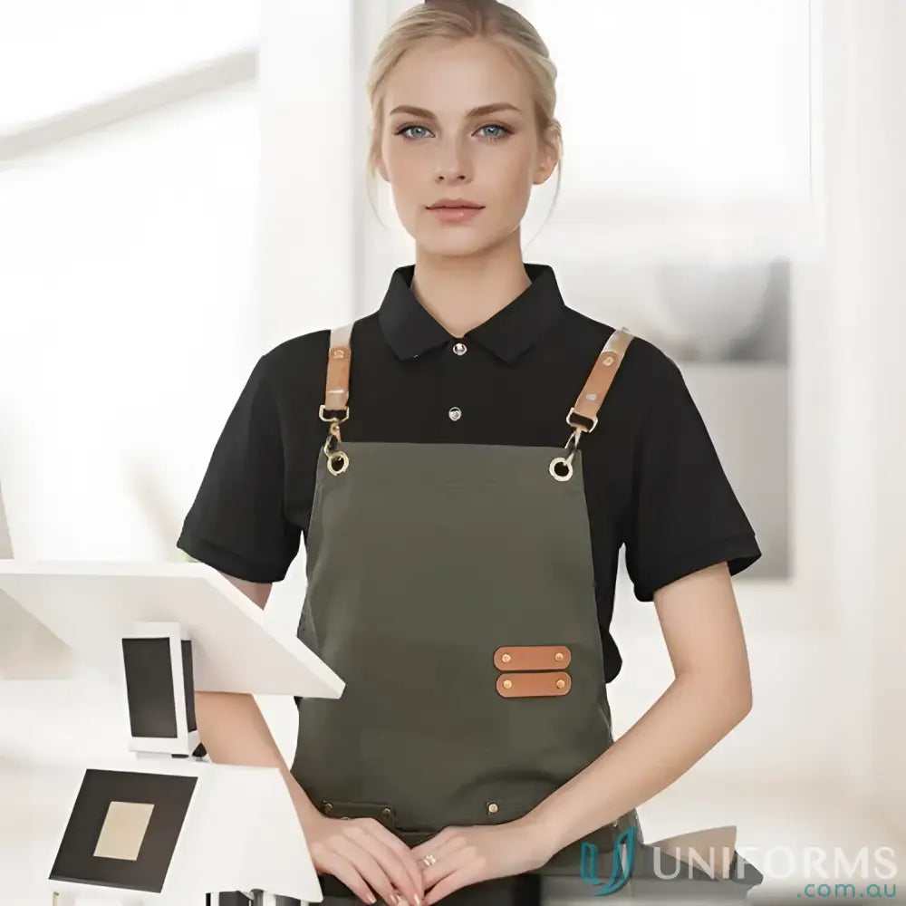 Woman wearing a stylish waterproof canvas kitchen apron with brown leather straps