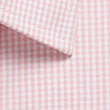 Westgarth Gingham long sleeve shirt with elongated triangular shadow on beige surface