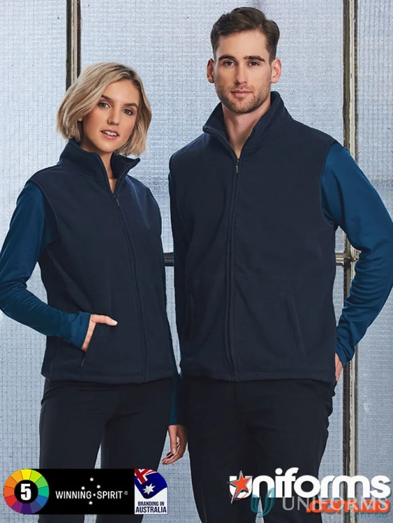 Two people showing off their Winning Spirit Freedom Polar Fleece Vest with anti-pill polar fabric
