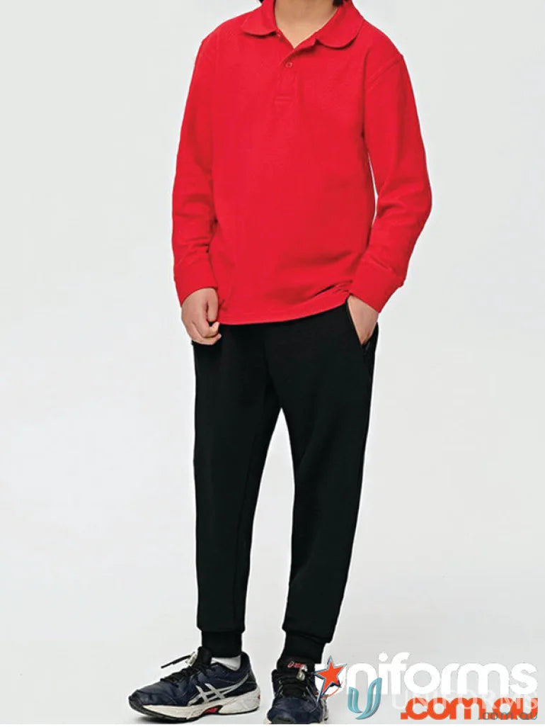Child wearing red polo and black sweatpants for Kids Spirit French Terry Track Pants TP25K