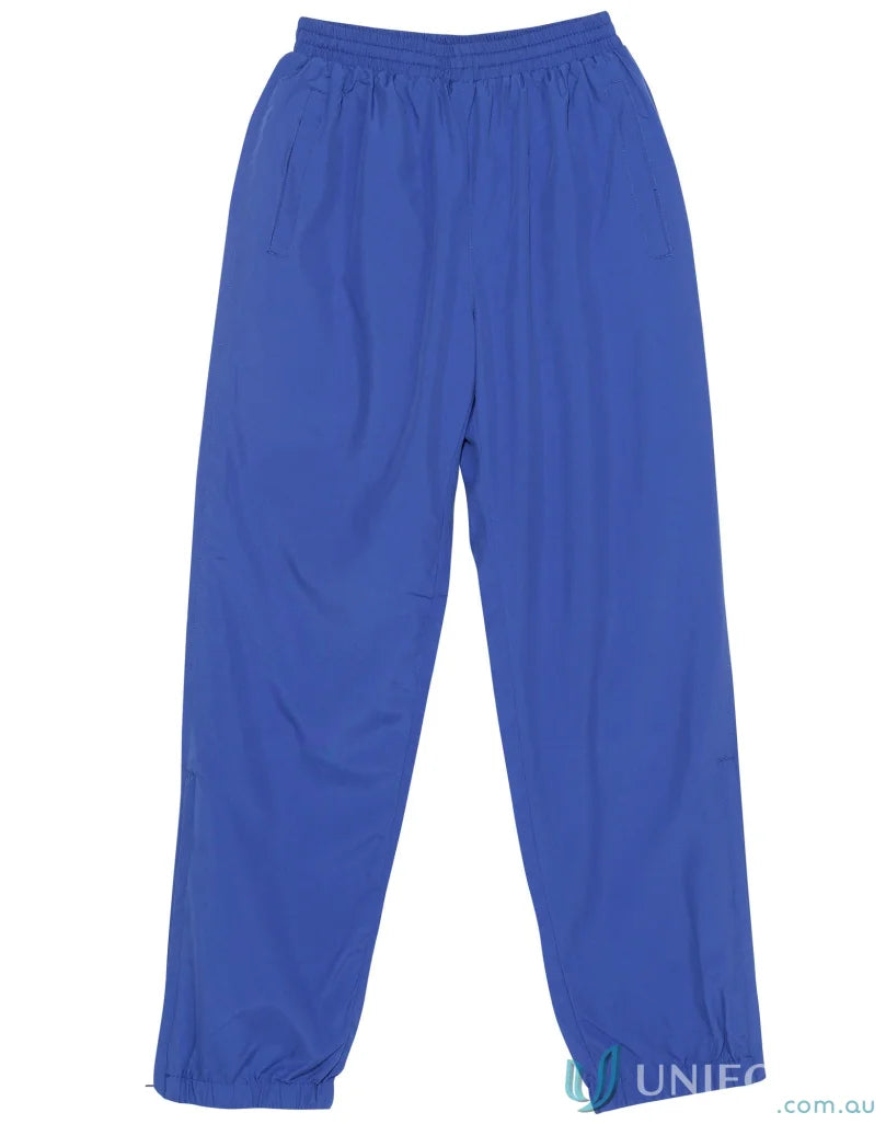 Winning Spirit Kids Legend Warm Up Pants with zip-up leg openings in blue athletic style