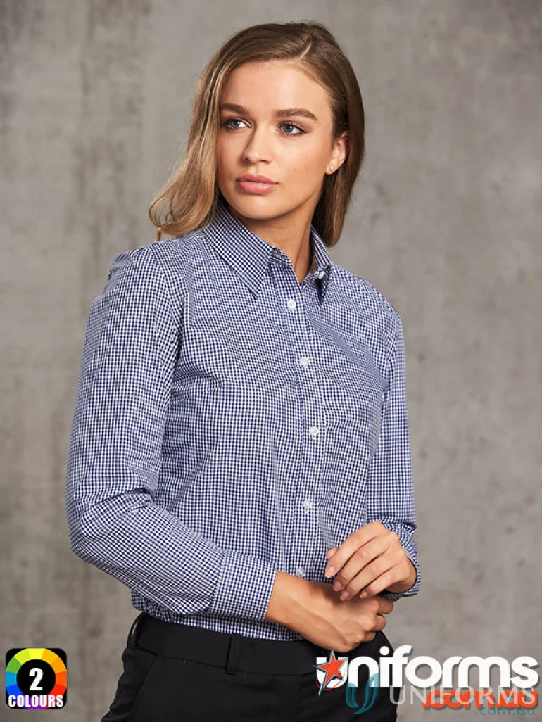 Woman wearing Winning Spirit Ladies’ multi-tone check long sleeve shirt in blue and white