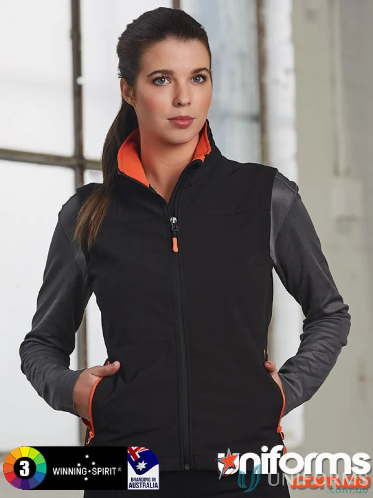 Woman wearing jk46 Rosewall soft shell vest in black and gray perfect for outdoor use