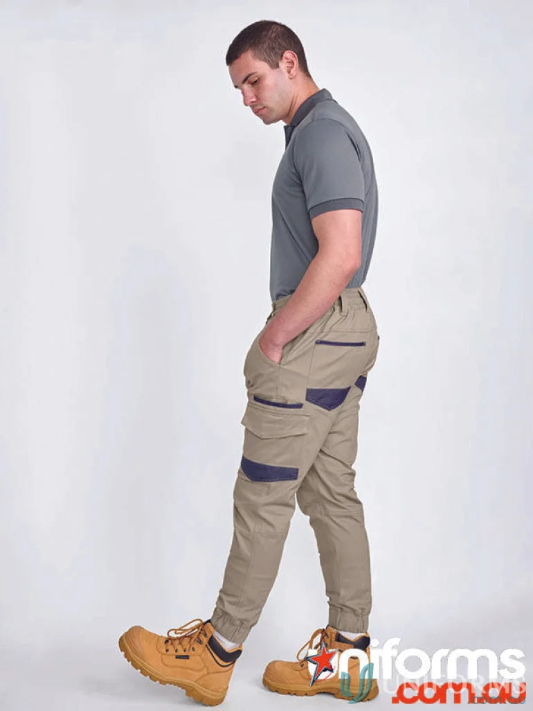 Man wearing unisex cotton stretch cuffed work pants in stretch drill cuffed style