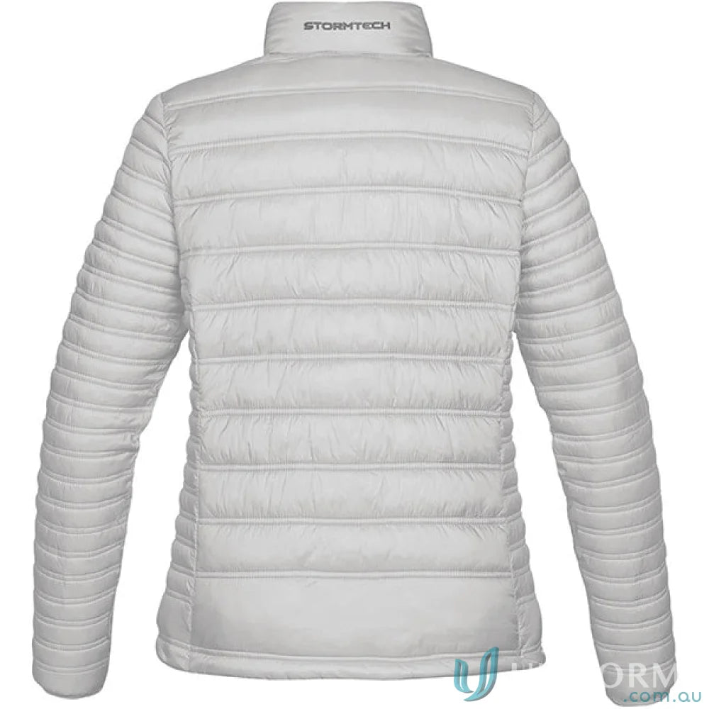 Light grey women’s Basecamp Jacket with high collar and horizontal quilting for outdoor adventures