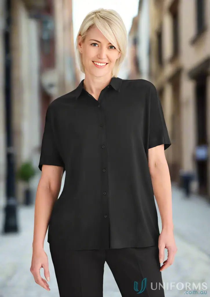 Smiling woman in women’s Dahlia Short Sleeve Blouse looking effortlessly elegant