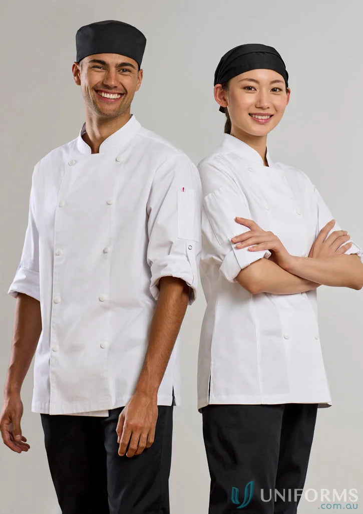 Two chefs wearing womens Gusto Long Sleeve Chef Jackets in a kitchen setting