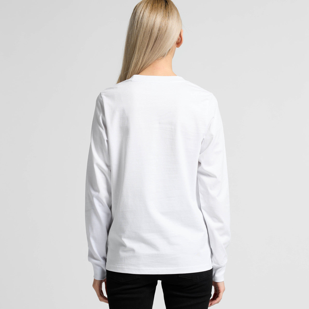 White versatile long sleeve tee for women with subtle back logo