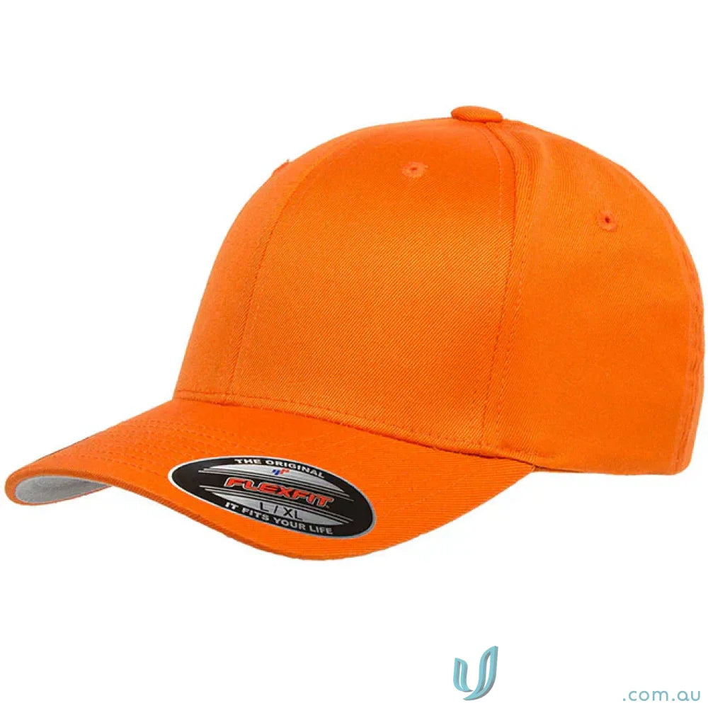 Orange fitted baseball cap showcasing Worn By The World Flexfit Cap 6277 with flexfit technology