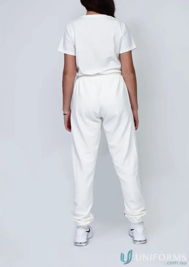 Youth track pant black outfit featuring a white t-shirt and sweatpants for casual style