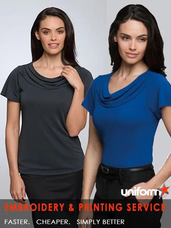 Two women modeling City Collection Brand short-sleeved cowl neck tops in dark grey and royal blue for modern workwear