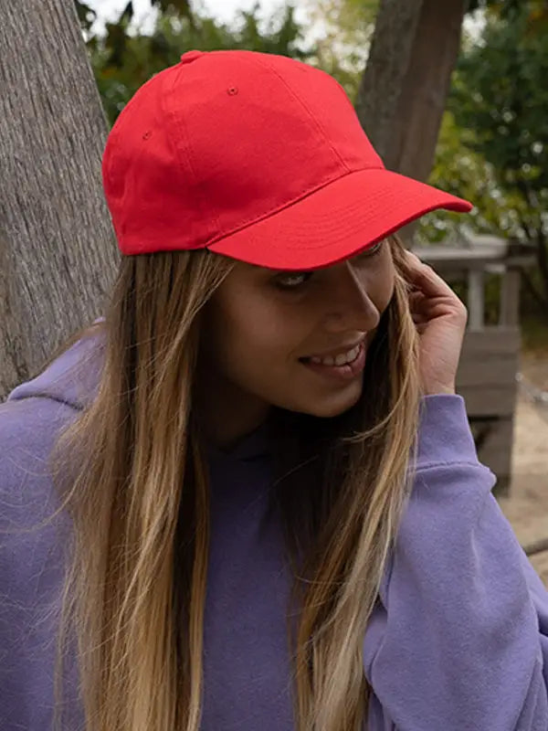 Red baseball cap on young woman showcasing headwear professionals caps and accessories