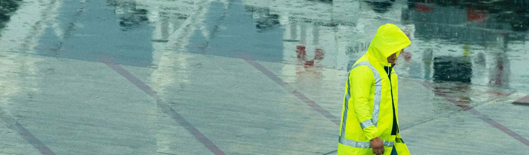 Yellow hooded raincoat from PPE PVC Rainsuits & Coveralls for reliable weather protection