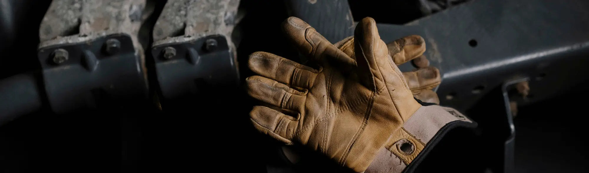 Tan leather work glove from PPE Synthetic Coated Gloves collection, perfect for safety jackets