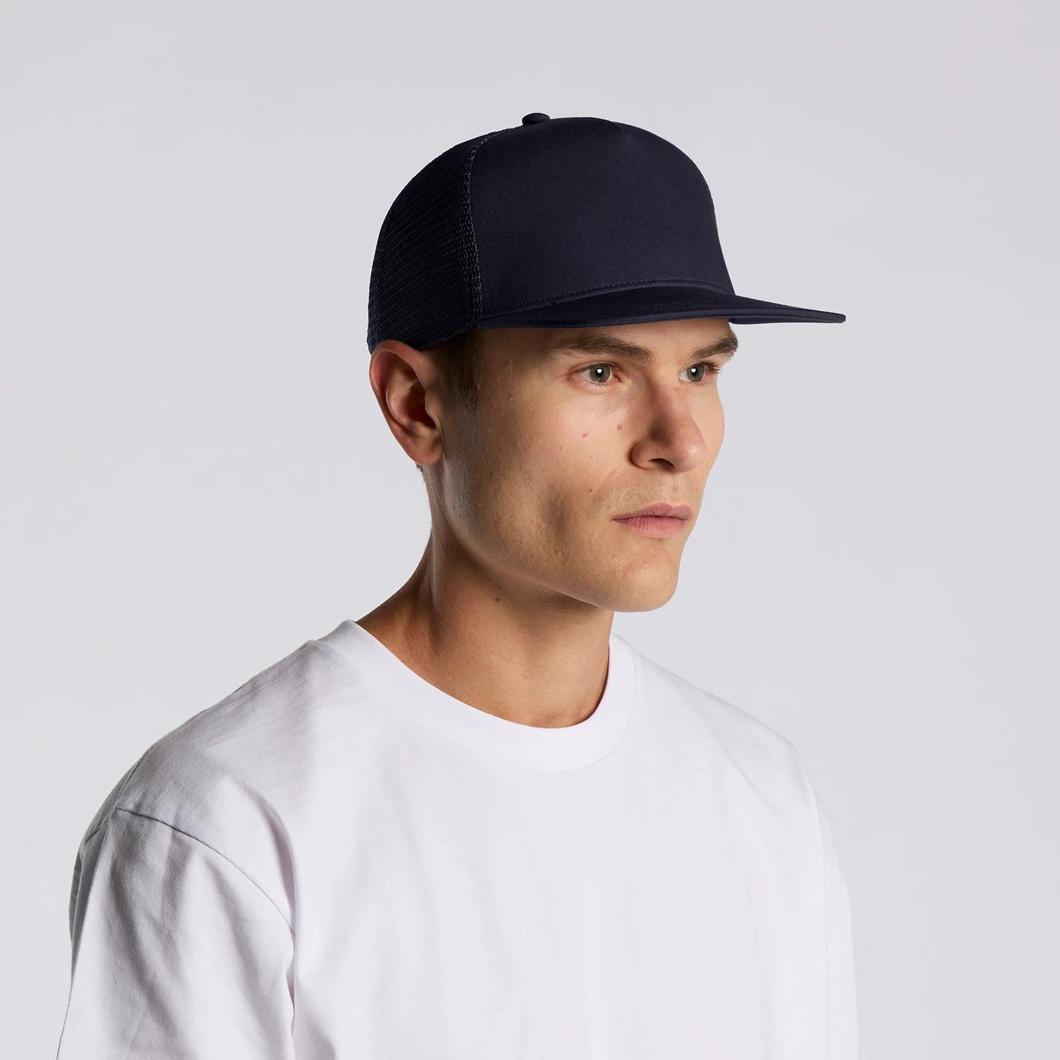 Navy blue as trucker cap with mesh back and solid front panel perfect for workwear and uniforms