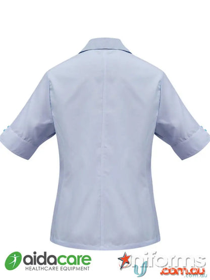 Light blue short-sleeved collared workwear shirt for work uniforms at Aidacare EMB