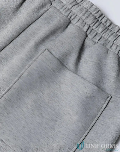Gray heathered airlayed cvc sweatpants with soft textured fabric and elastic waistband ideal for workwear uniforms