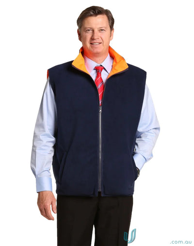Man in navy AIW HiVis Reversible Safety Vest showcasing winning spirit sw49 style