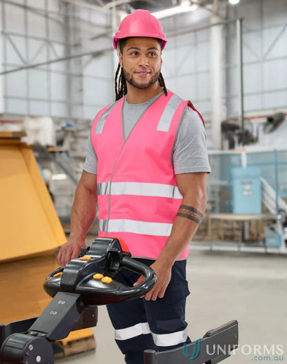 Man operating a pallet jack in sw43 safety vest with high visibility from AIW Safety